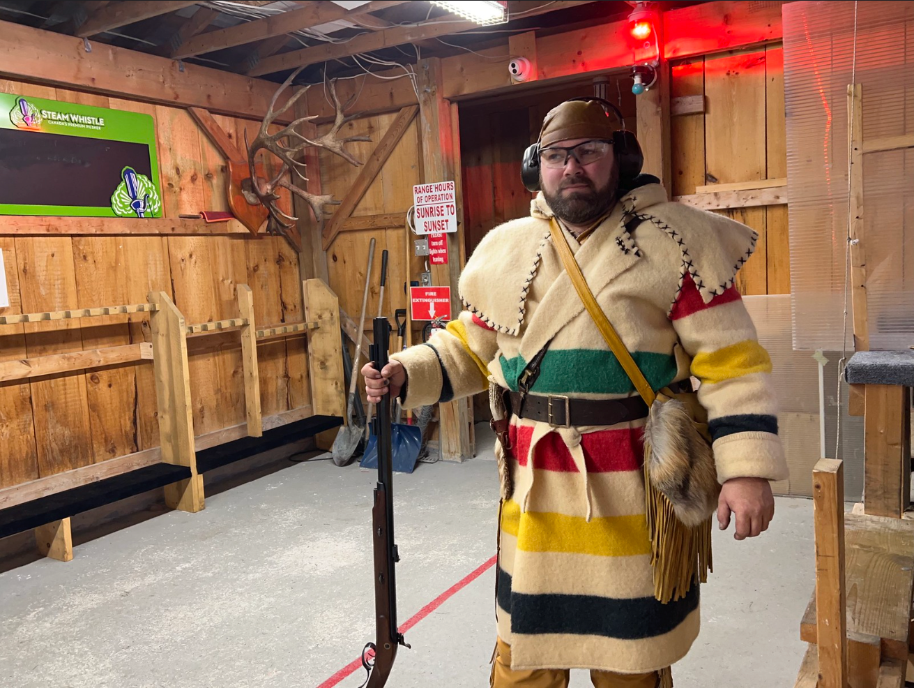 Wolfmaan wearing a Hudson's Bay Coat and Hawken style rifle